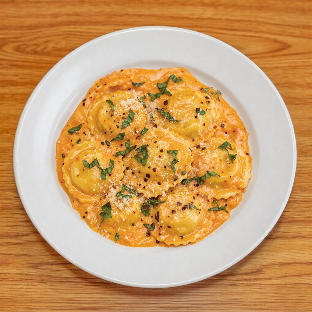 Butternut Squash Ravioli in Roasted Red Bell Pepper Sauce.